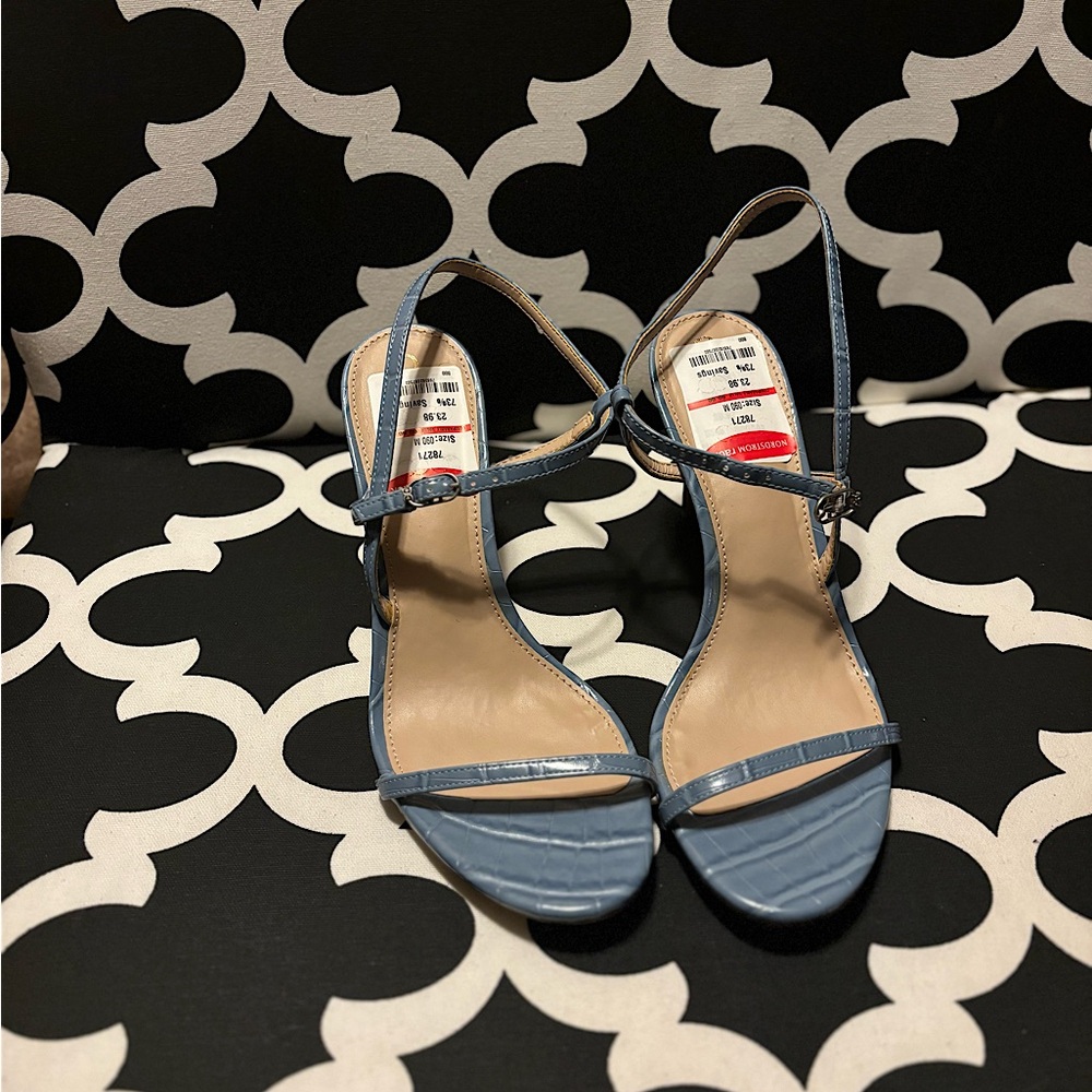Women’s snake skin type baby blue heels